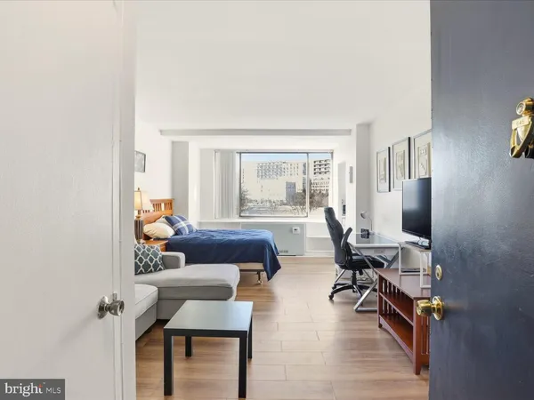 a living room with furniture and a window