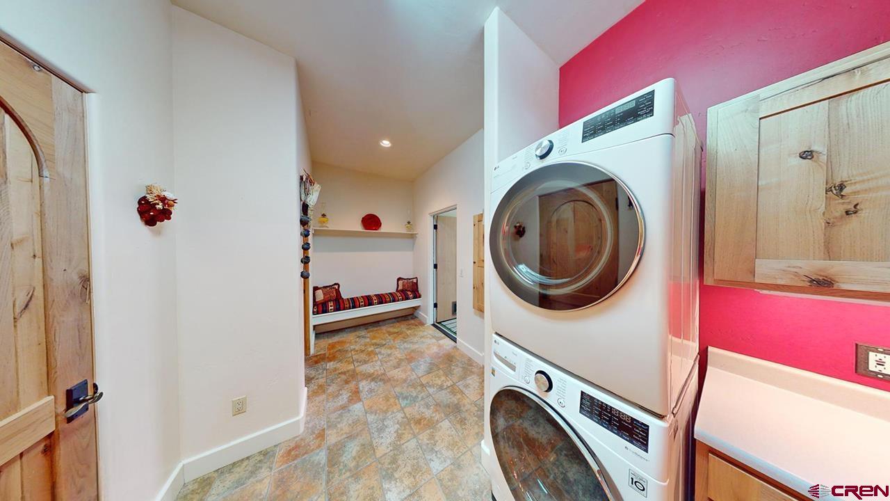4365 County Road 237 Durango, CO 81301 - Photo 18 of 35 a view of a storage & utility room with washer and dryer