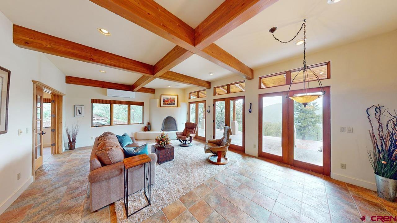 4365 County Road 237 Durango, CO 81301 - Photo 5 of 35 a living room with furniture a window and wooden floor