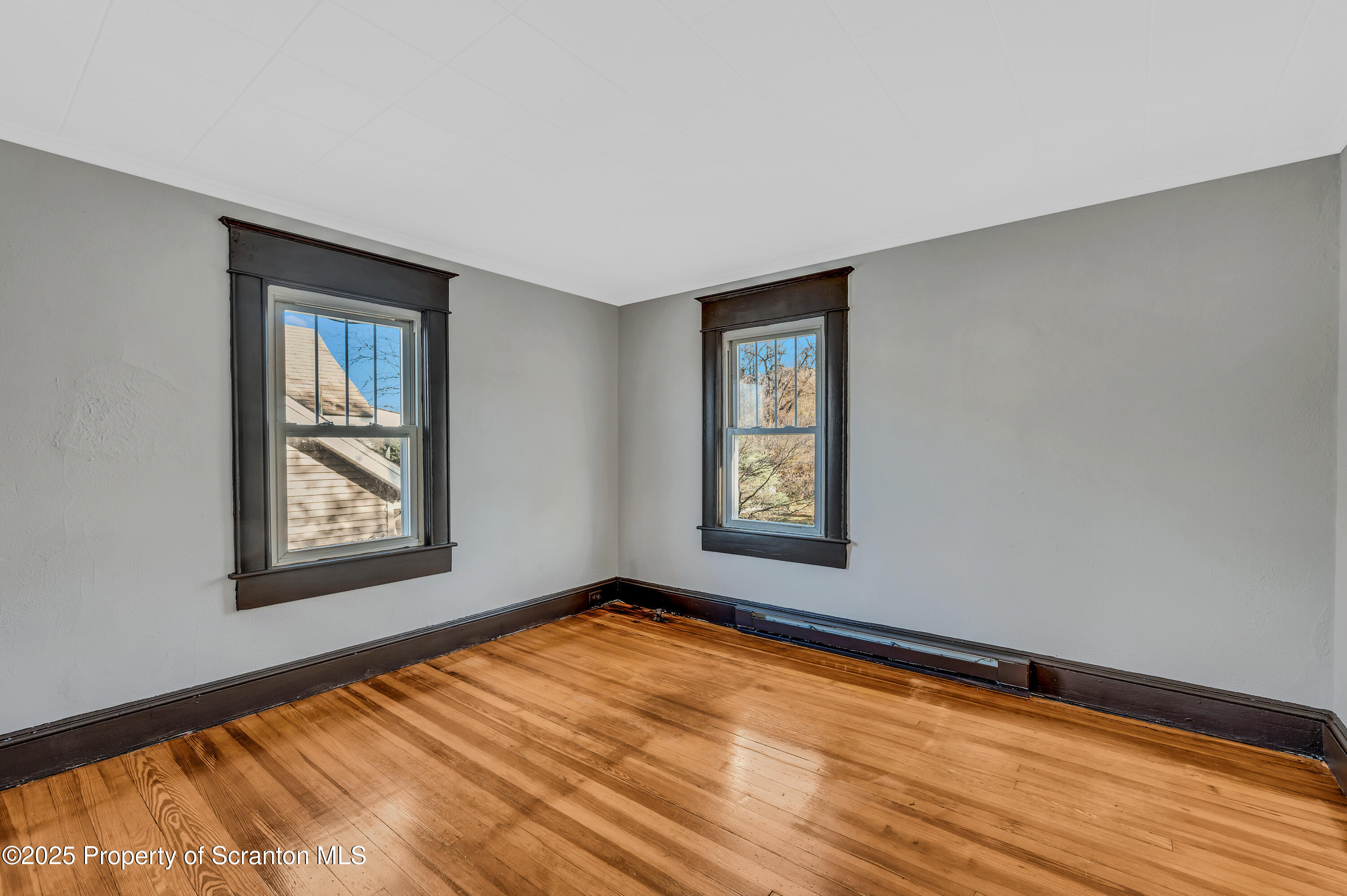 21 Stafford Avenue Scranton, PA 18505 - Photo 13 of 21 a view of an empty room with window and wooden floor