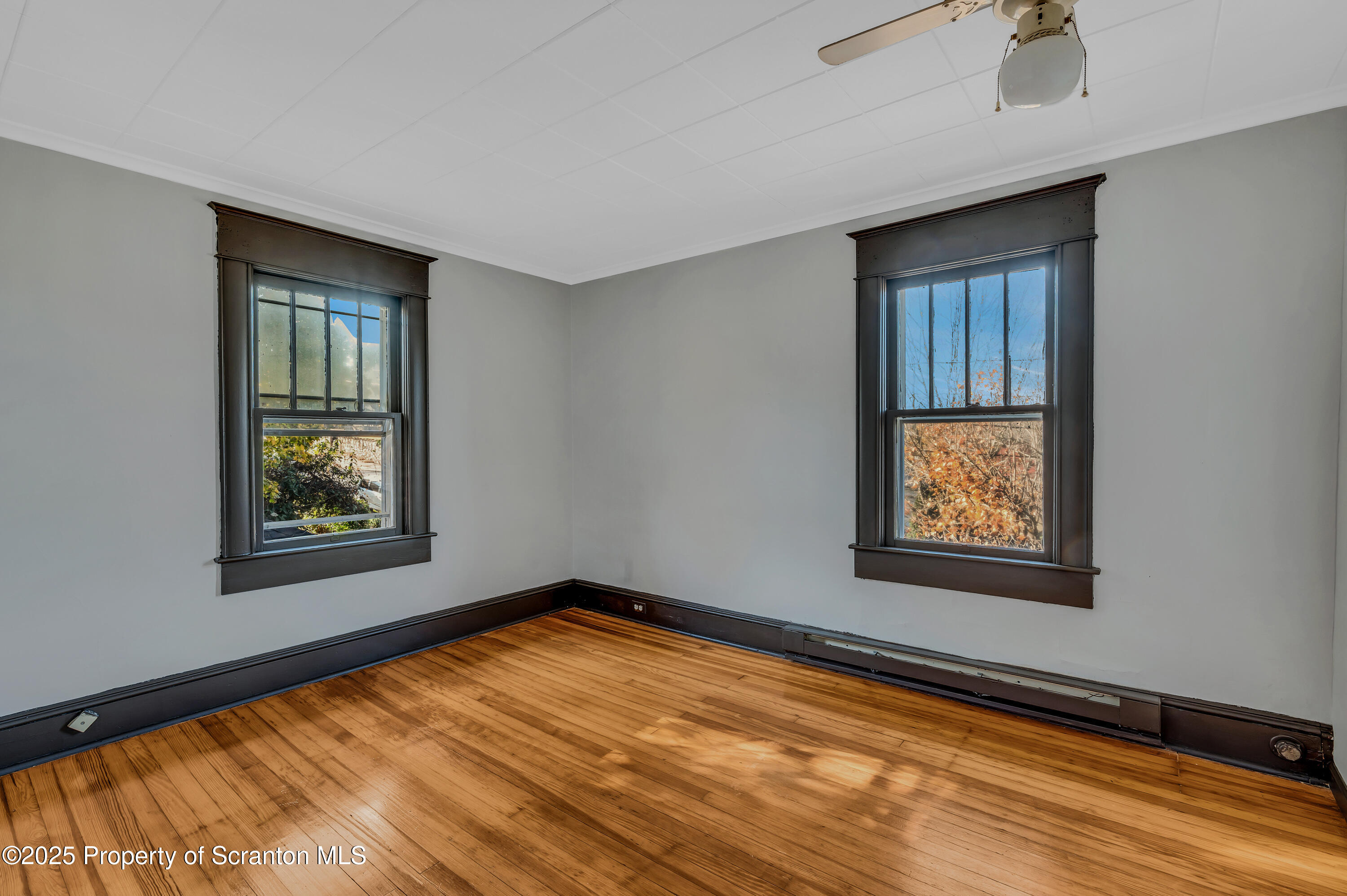 21 Stafford Avenue Scranton, PA 18505 - Photo 4 of 21 a view of an empty room with window and wooden floor
