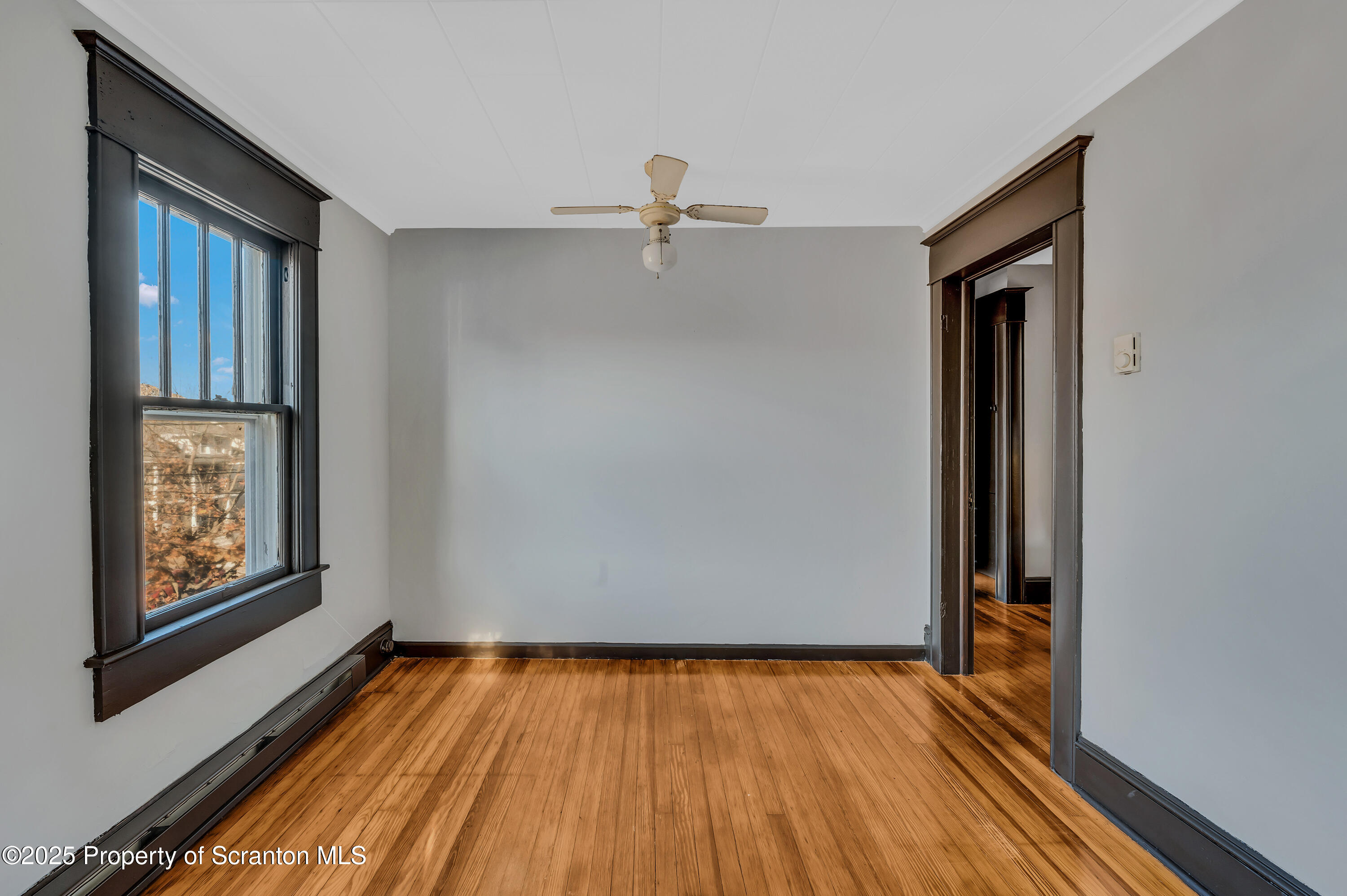 21 Stafford Avenue Scranton, PA 18505 - Photo 6 of 21 a view of an empty room with wooden floor and a window