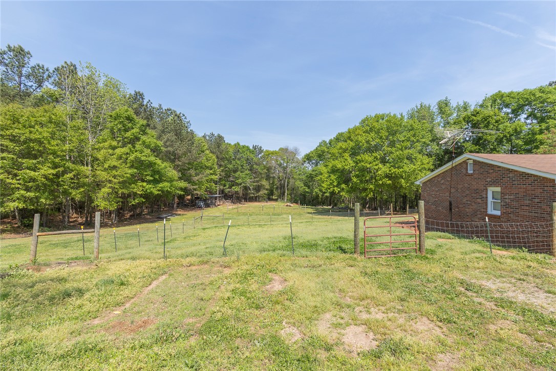 820 Travis Road Anderson, SC 29626 - Photo 5 of 46 Expansive green fields offer an ideal setting for outdoor activities and potential development.