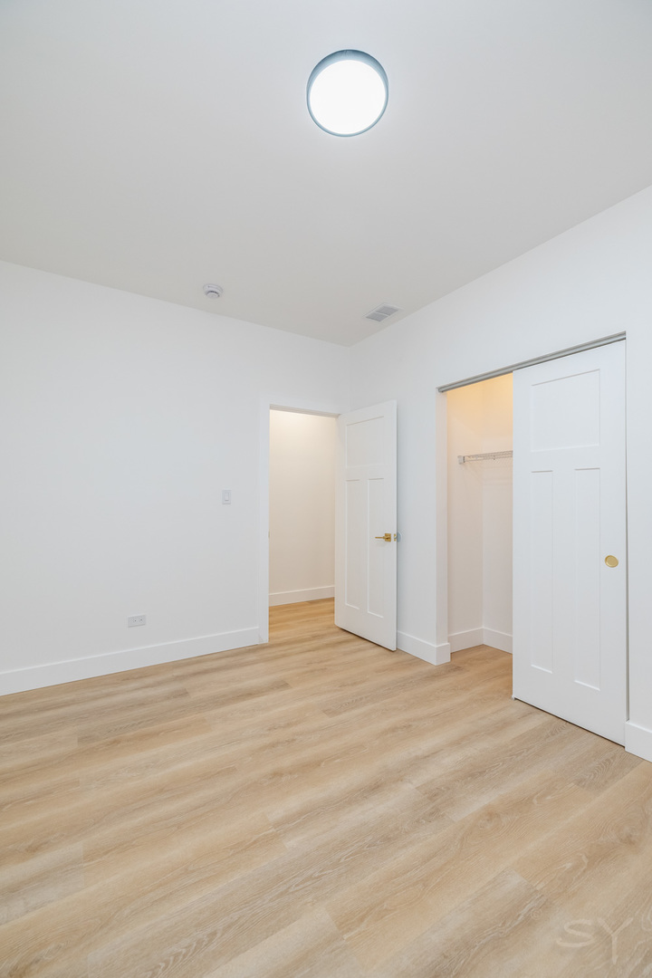 2949 West 25th Place, Unit 1 Chicago, IL 60623 - Photo 19 of 42 a view of an empty room