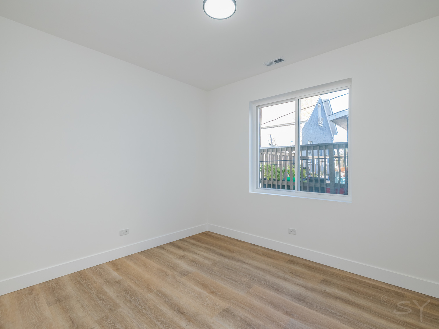 2949 West 25th Place, Unit 1 Chicago, IL 60623 - Photo 22 of 42 an empty room with a window