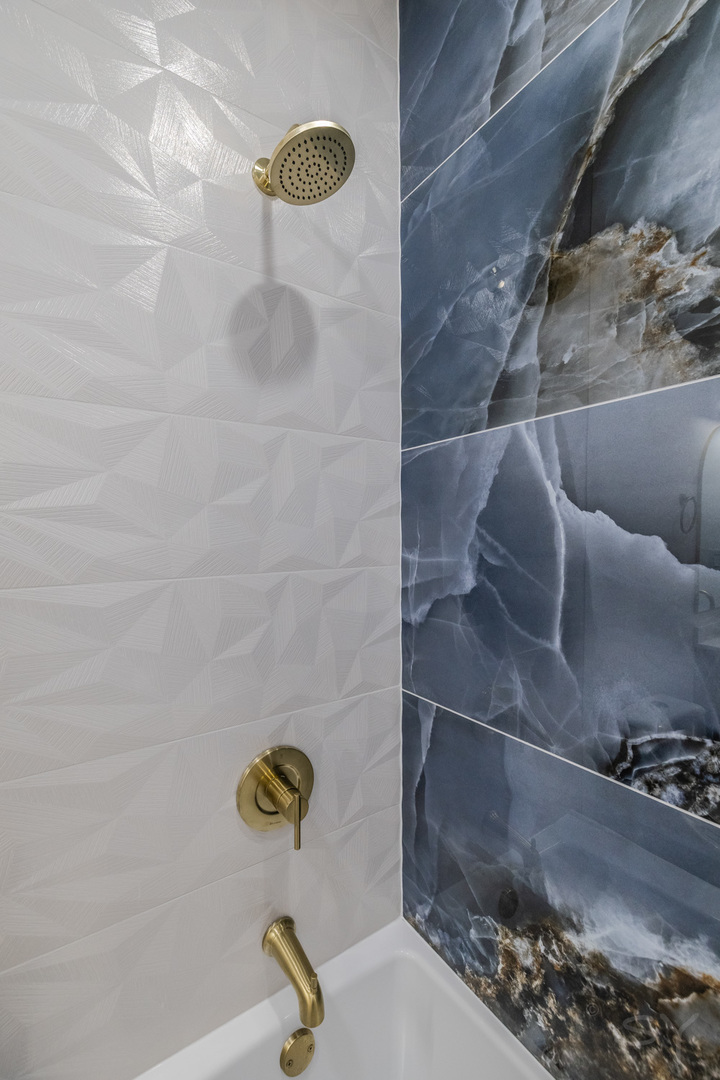 2949 West 25th Place, Unit 1 Chicago, IL 60623 - Photo 31 of 42 a bathroom with a shower