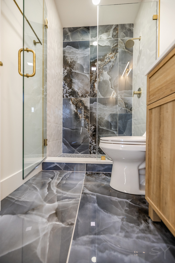 2949 West 25th Place, Unit 1 Chicago, IL 60623 - Photo 40 of 42 a bathroom with a shower and toilet