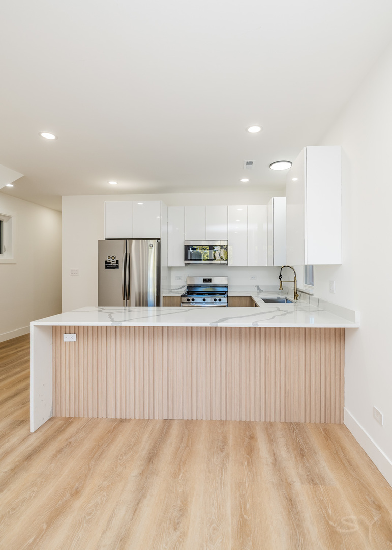 2949 West 25th Place, Unit 1 Chicago, IL 60623 - Photo 7 of 42 a view of kitchen with counter top space