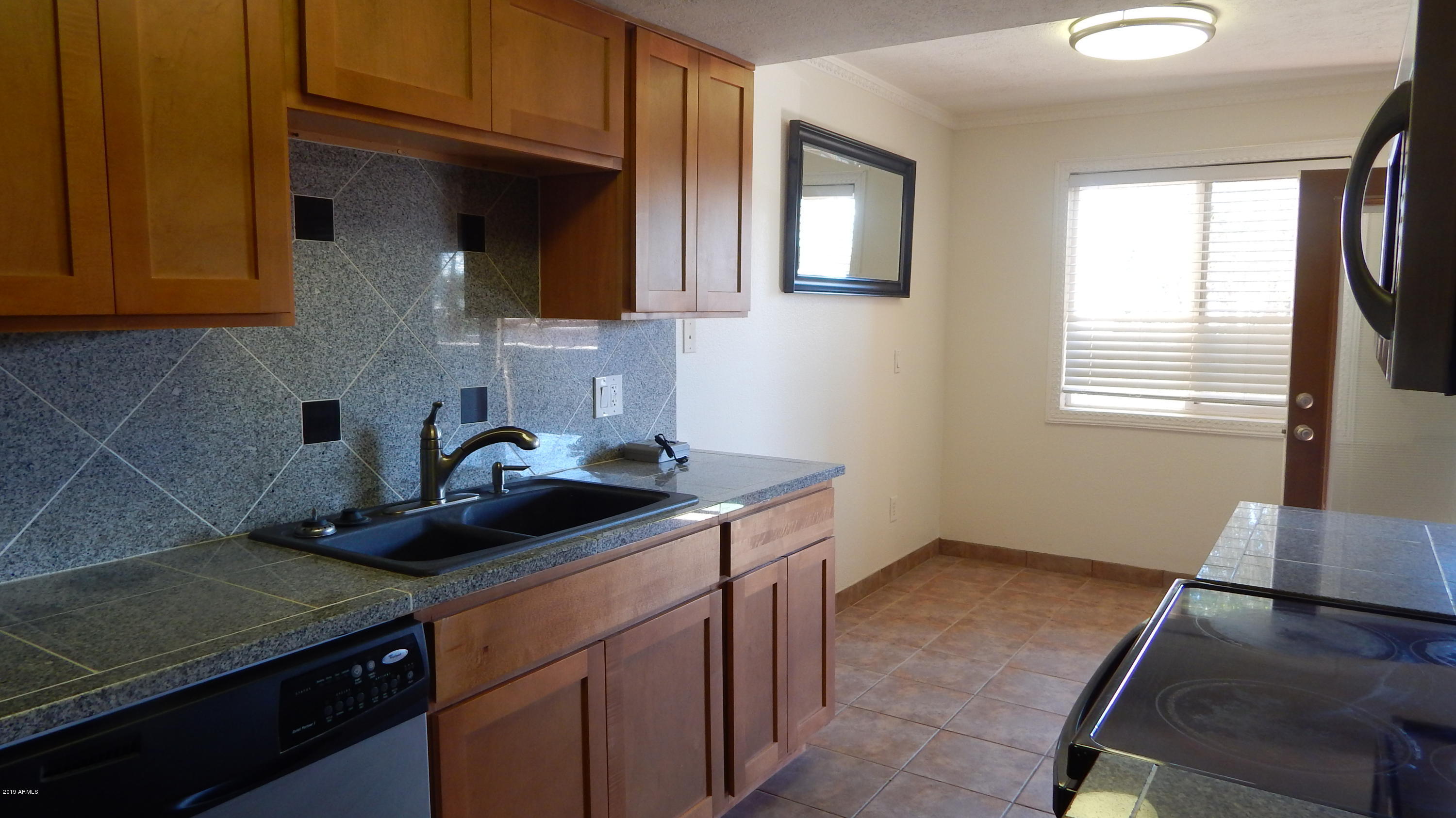 151 East Broadway Road, Unit 205 Tempe, AZ 85282 - Photo 1 of 26 Kitchen and Dining Area