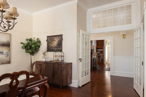 a view of a entryway with furniture and wooden floor