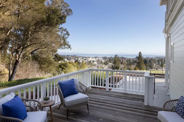 a view of a balcony with wooden floor