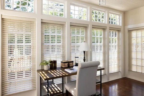 a view of a dining room with furniture and windows