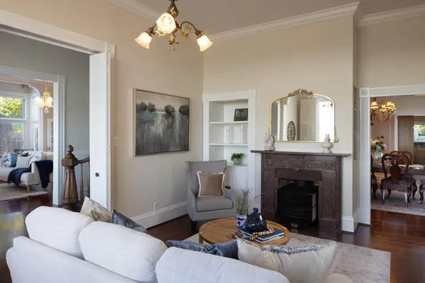 a living room with furniture and a fireplace