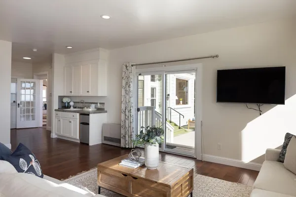 a living room with fireplace furniture and a flat screen tv