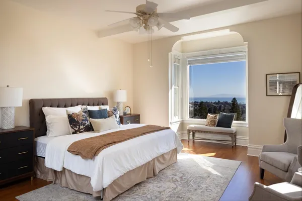 a bedroom with bed and a couch