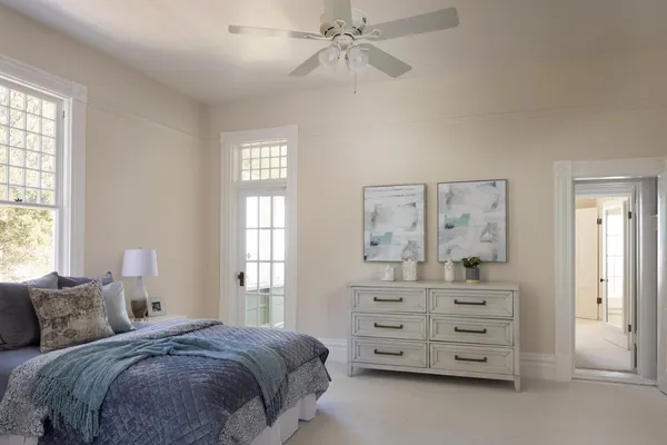 a view of a livingroom with lounge chair and a window