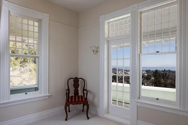 a view of a hallway with entryway door
