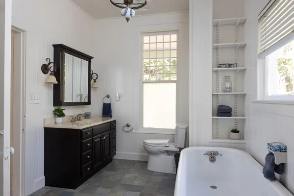 a view of hallway with stairs and wooden floor