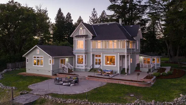 a house with trees in front of it