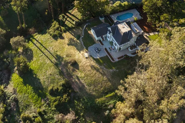 a view of outside house with a yard