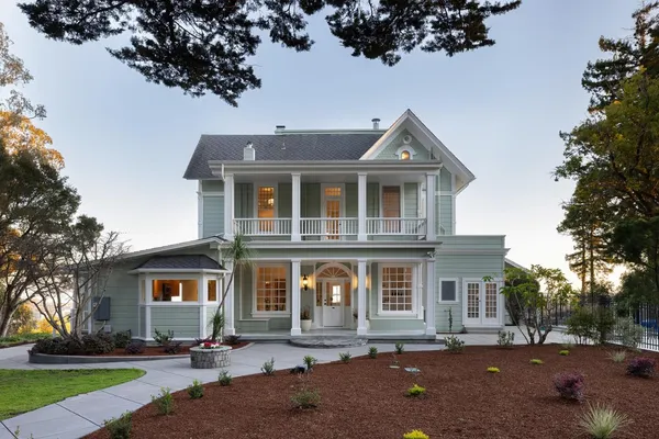 a front view of a house with a yard