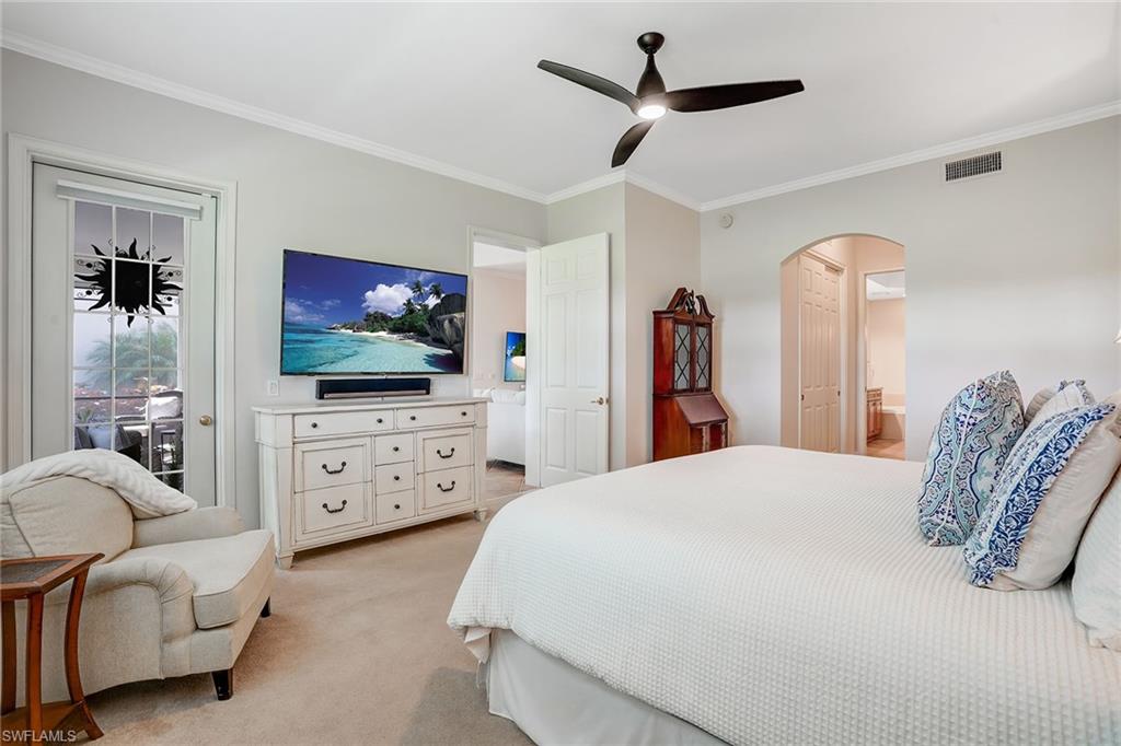 9350 Triana Terrace, Unit 292 Fort Myers, FL 33912 - Photo 15 of 28 a bedroom with furniture and a flat screen tv