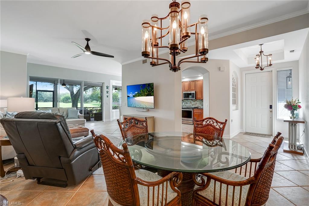 9350 Triana Terrace, Unit 292 Fort Myers, FL 33912 - Photo 3 of 28 a view of a dining room with furniture window and outside view
