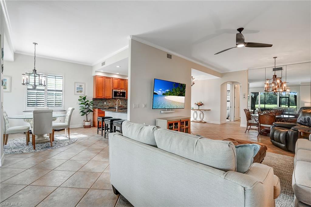 9350 Triana Terrace, Unit 292 Fort Myers, FL 33912 - Photo 7 of 28 a living room with furniture and kitchen view
