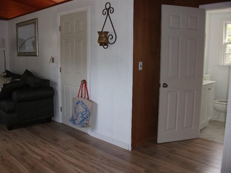 73 Shad Hole Road, Unit 3 Dennis Port, MA 02639 - Photo 8 of 15 a view of an entryway with wooden floor