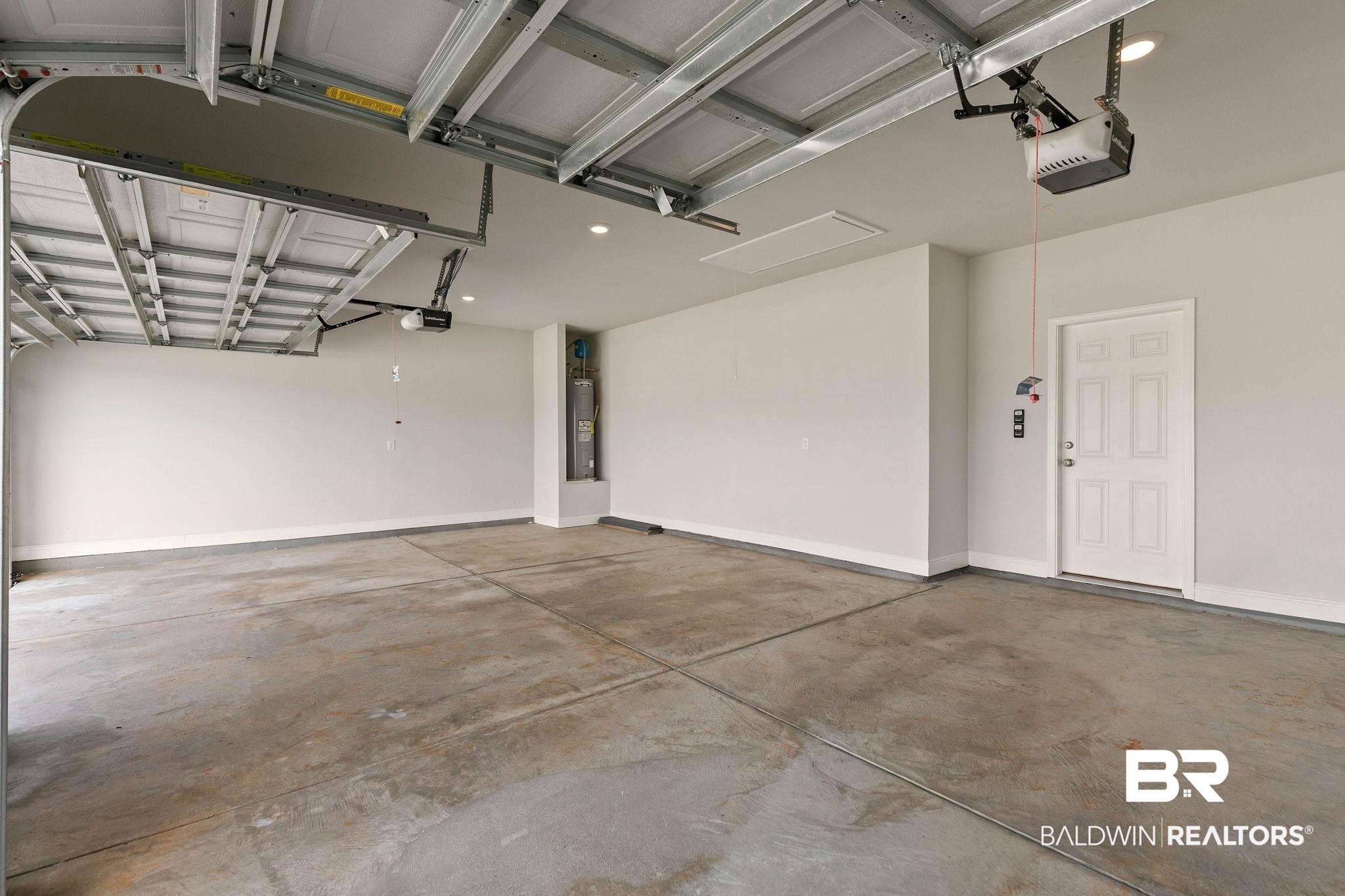 9448 Amethyst Drive Daphne, AL 36526 - Photo 48 of 61 Garage with recessed lighting, a garage door opener, and water heater