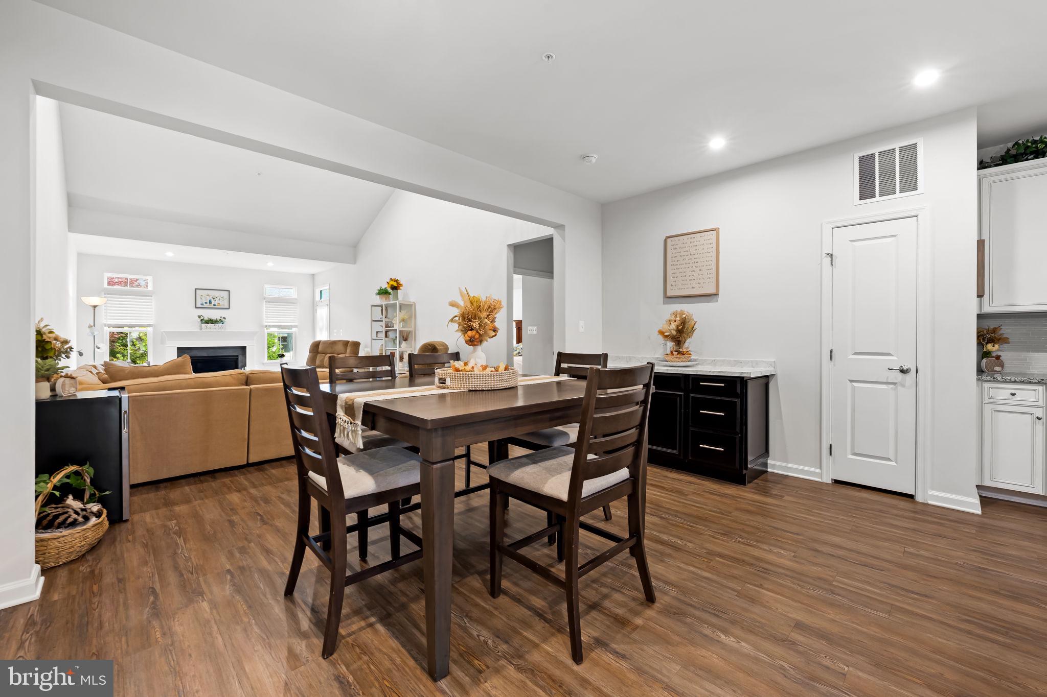 7728 Pestle Lane Glen Burnie, MD 21060 - Photo 14 of 66 a view of a dining room with furniture and wooden floor