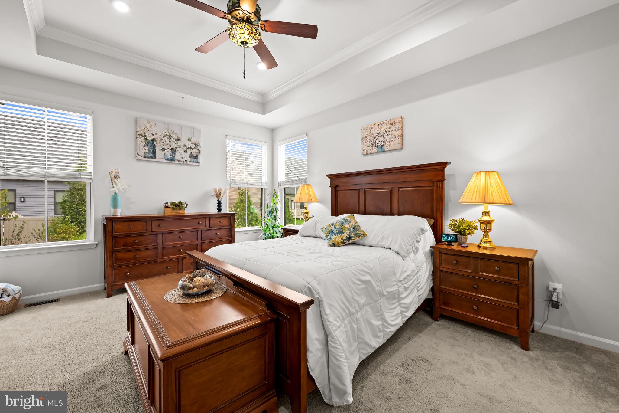 7728 Pestle Lane Glen Burnie, MD 21060 - Photo 19 of 66 a bed room with a bed and a chandelier