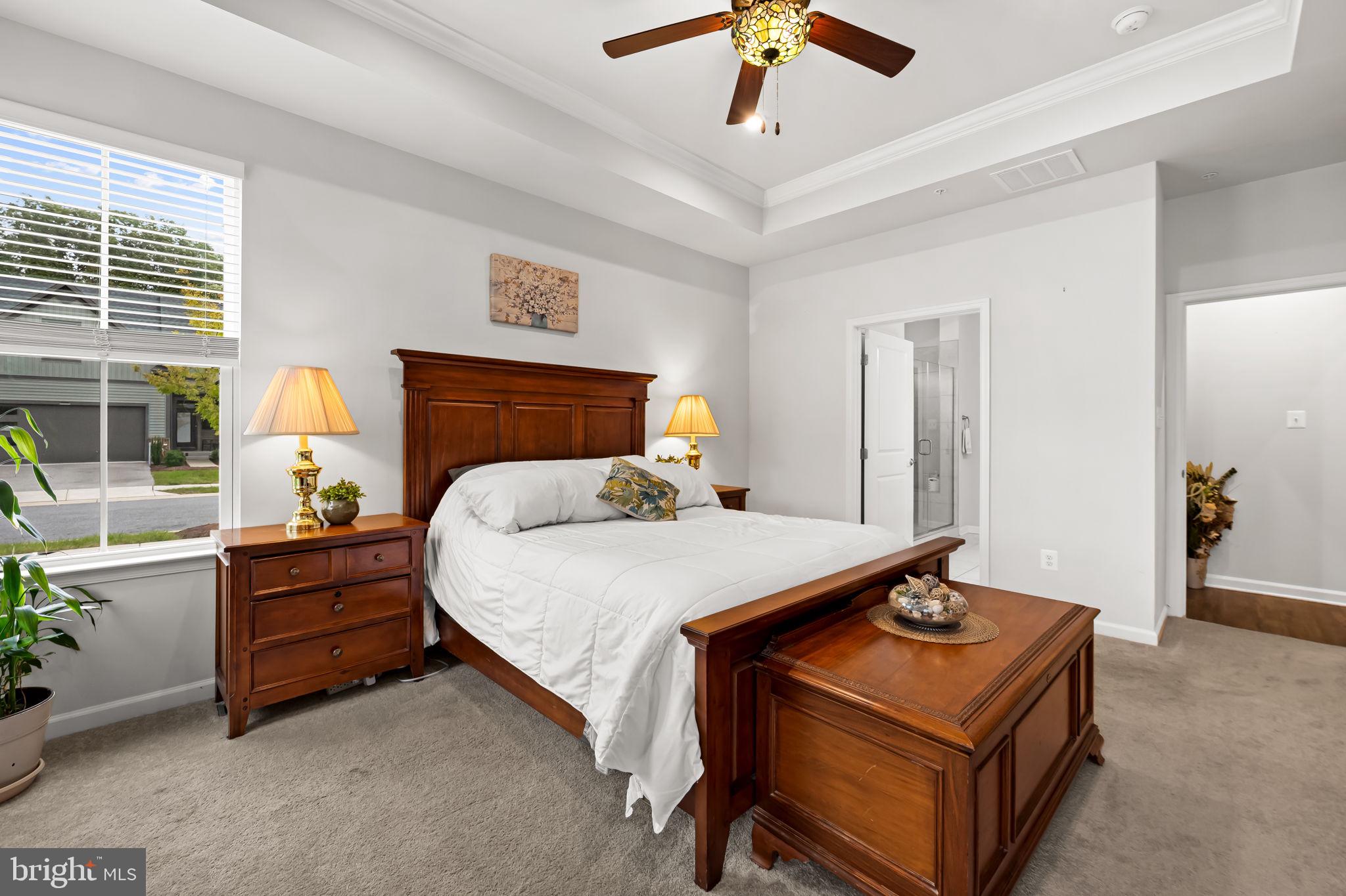 7728 Pestle Lane Glen Burnie, MD 21060 - Photo 20 of 66 a bed room with a bed and a chandelier