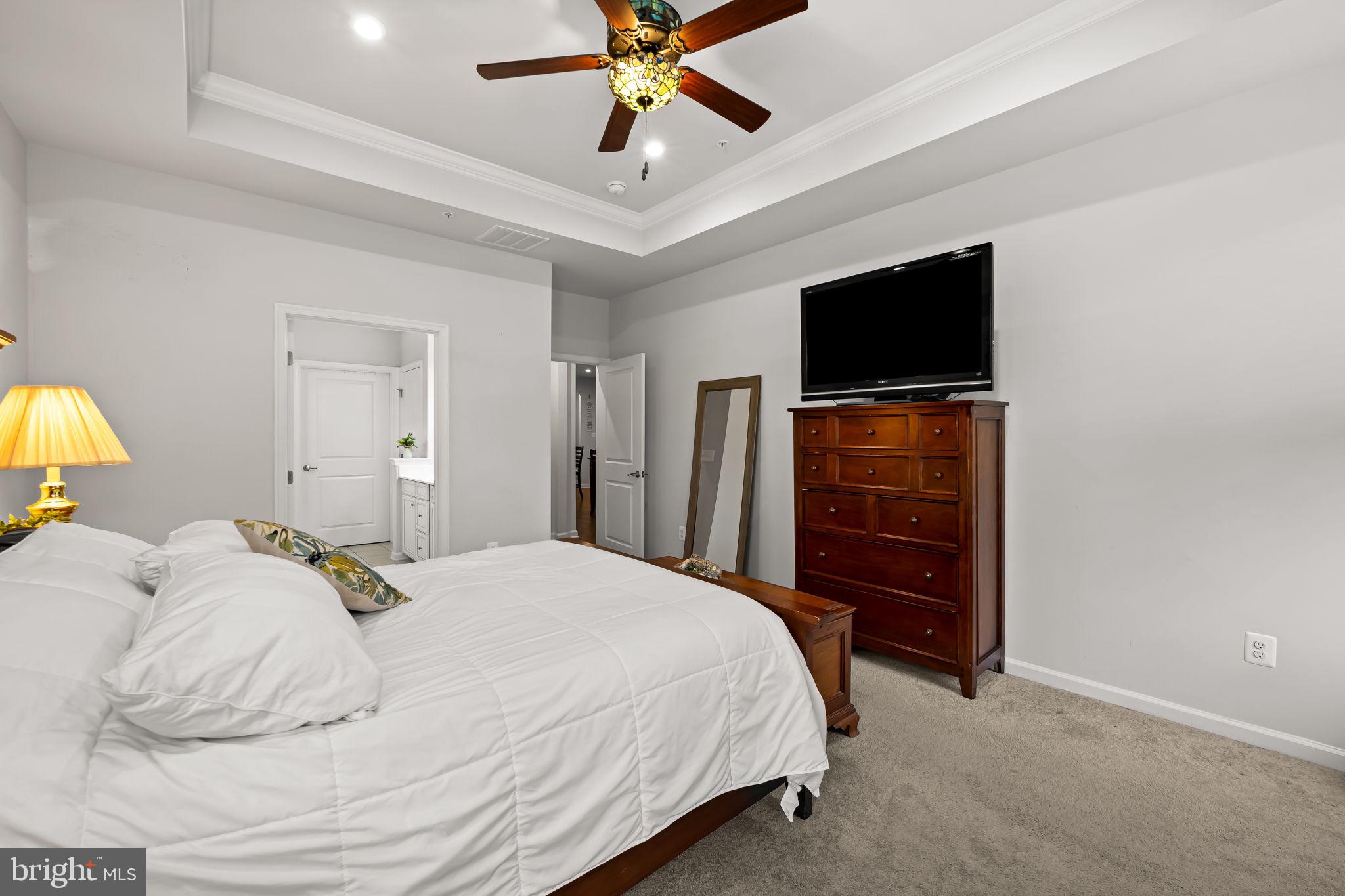 7728 Pestle Lane Glen Burnie, MD 21060 - Photo 21 of 66 a bedroom with a bed and a flat screen tv