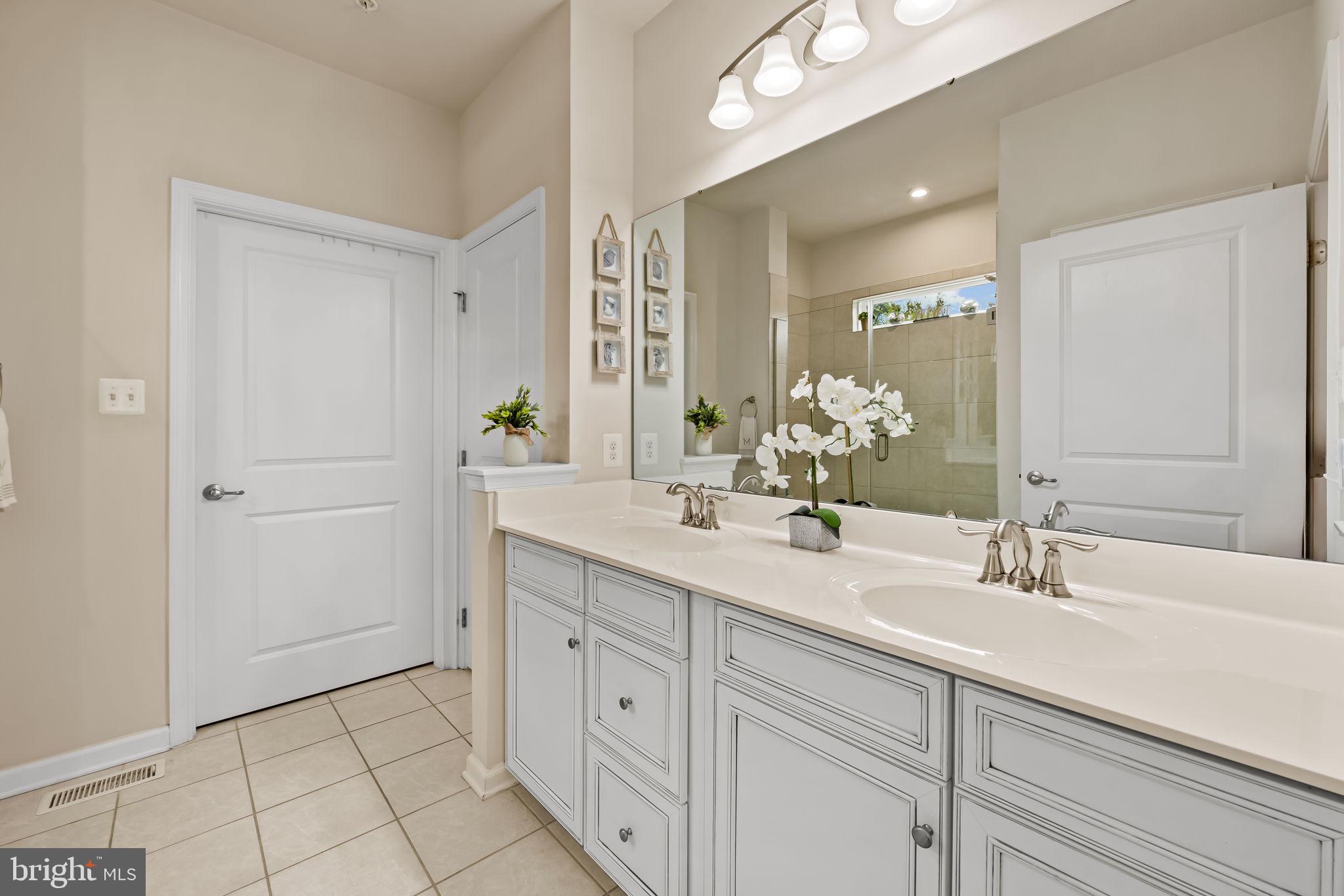 7728 Pestle Lane Glen Burnie, MD 21060 - Photo 22 of 66 a bathroom with a sink and a mirror