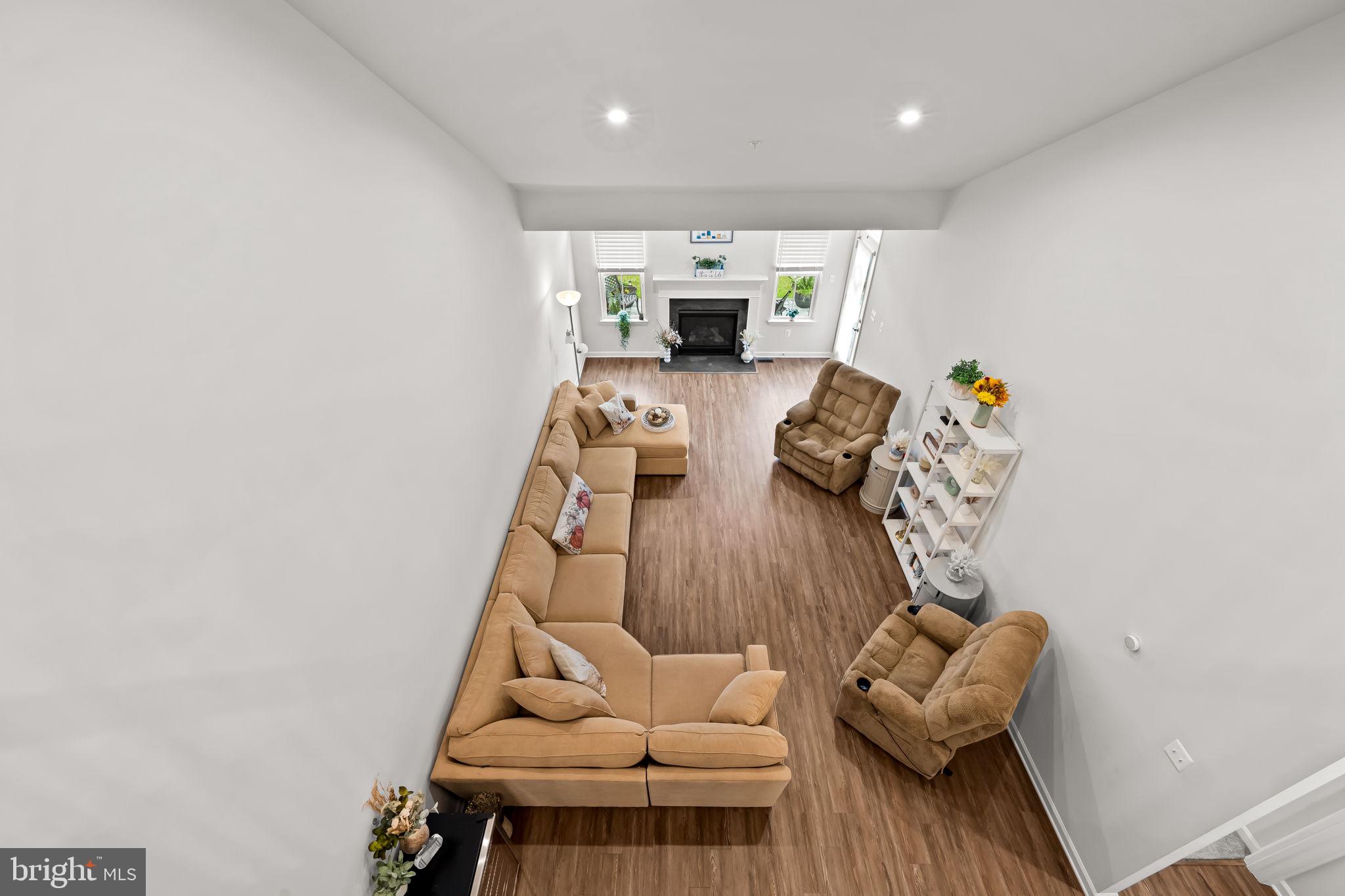 7728 Pestle Lane Glen Burnie, MD 21060 - Photo 27 of 66 a living room with furniture and a wooden floor