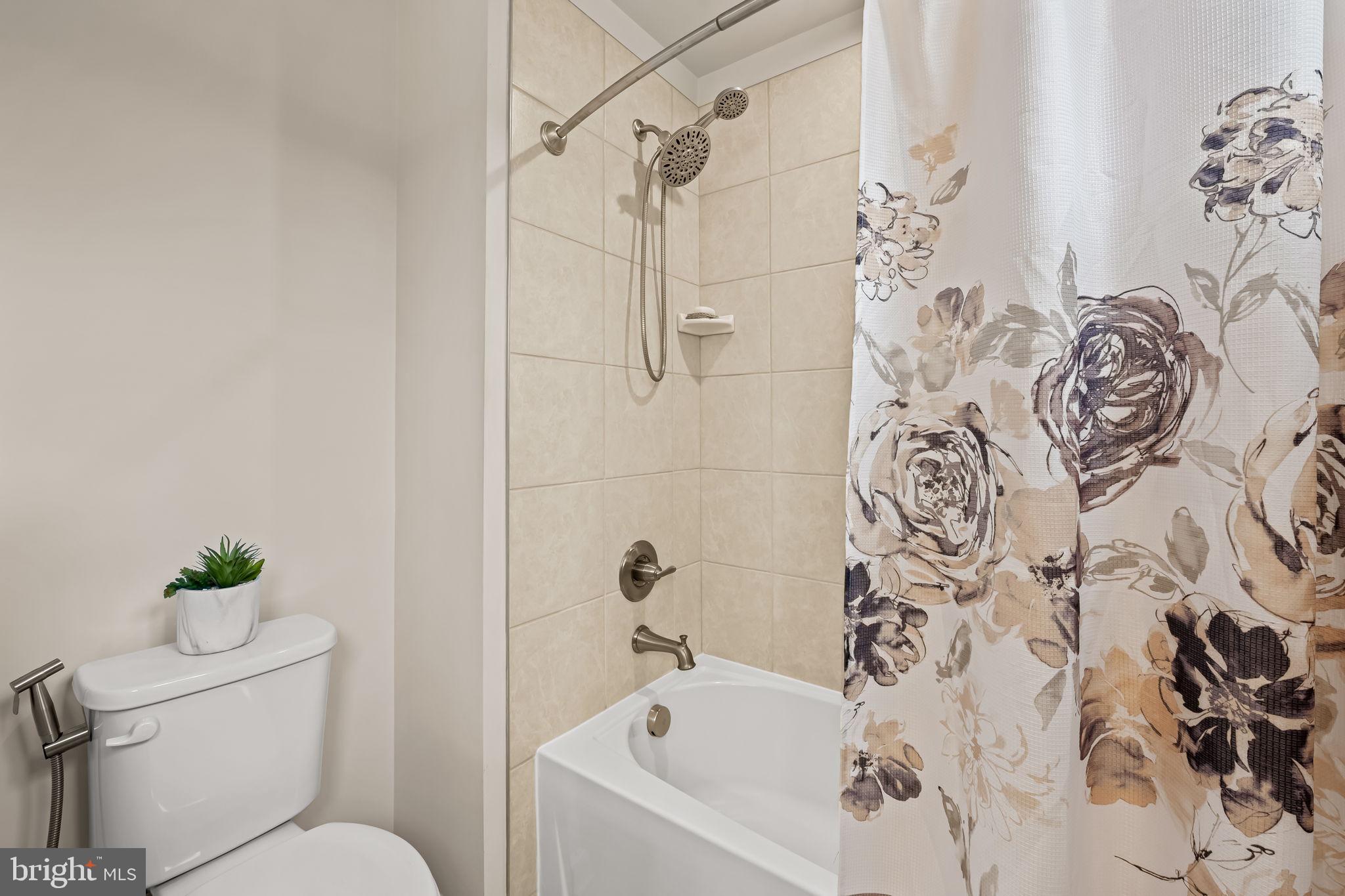 7728 Pestle Lane Glen Burnie, MD 21060 - Photo 33 of 66 a white bath tub with a toilet