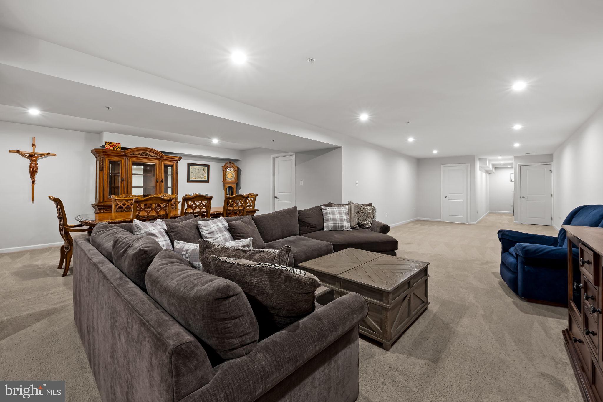 7728 Pestle Lane Glen Burnie, MD 21060 - Photo 38 of 66 a living room with furniture and a flat screen tv