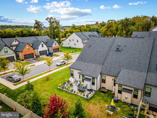 a view of a swimming pool with outdoor seating