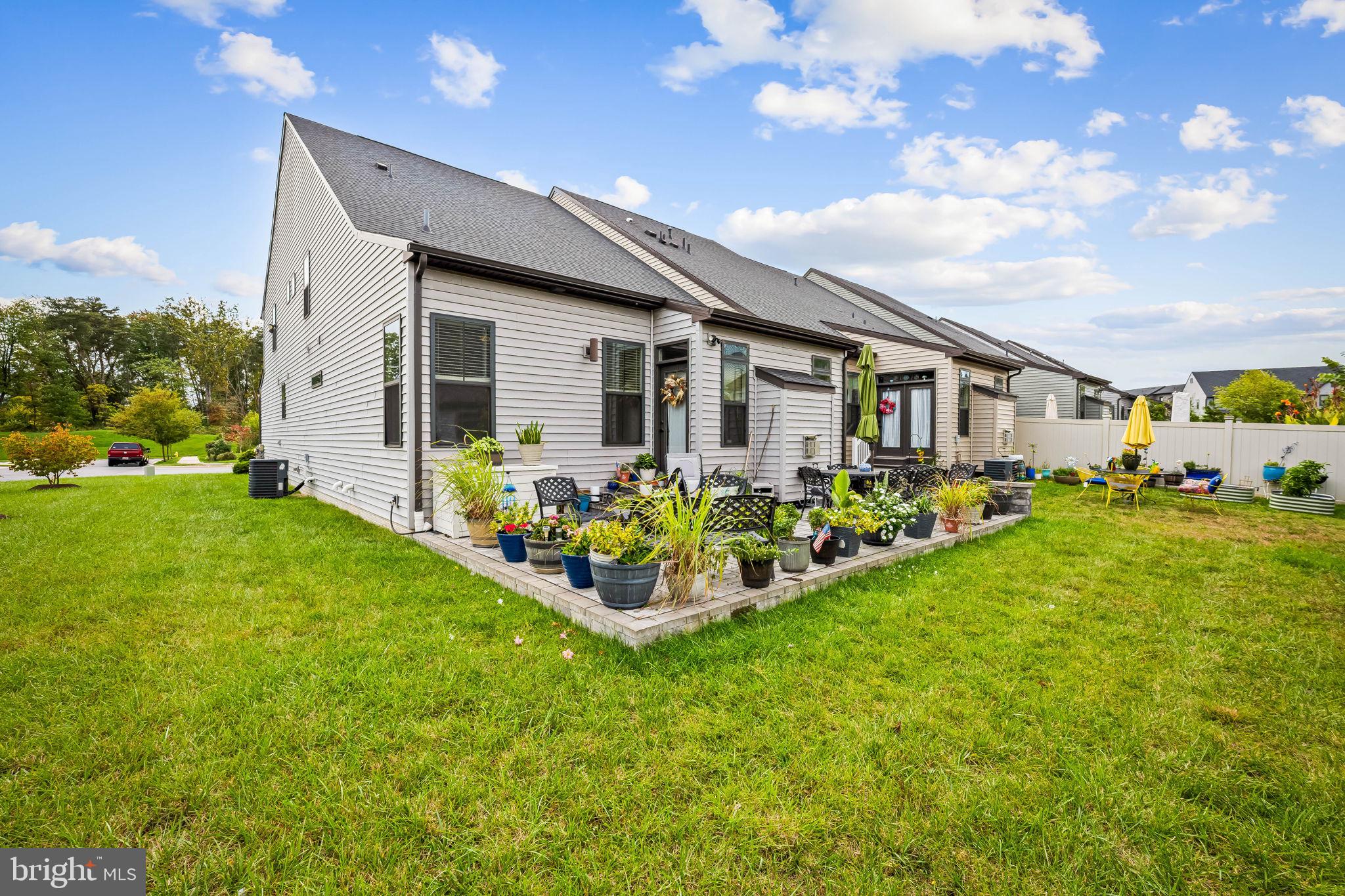 7728 Pestle Lane Glen Burnie, MD 21060 - Photo 52 of 66 a view of a house with backyard porch and garden