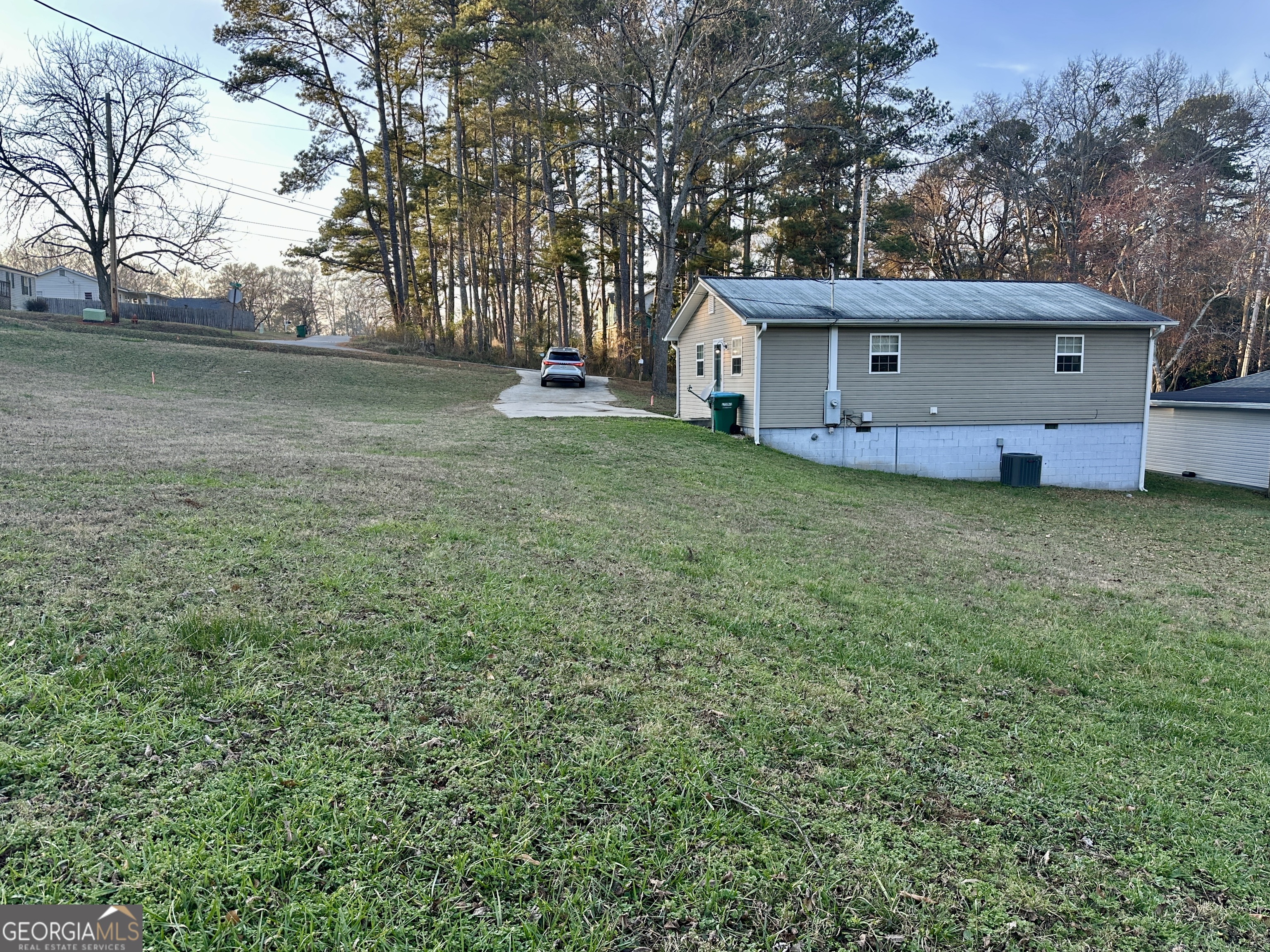 122 Forest Avenue Commerce, GA 30529 - Photo 16 of 17 a view of a house with a back yard