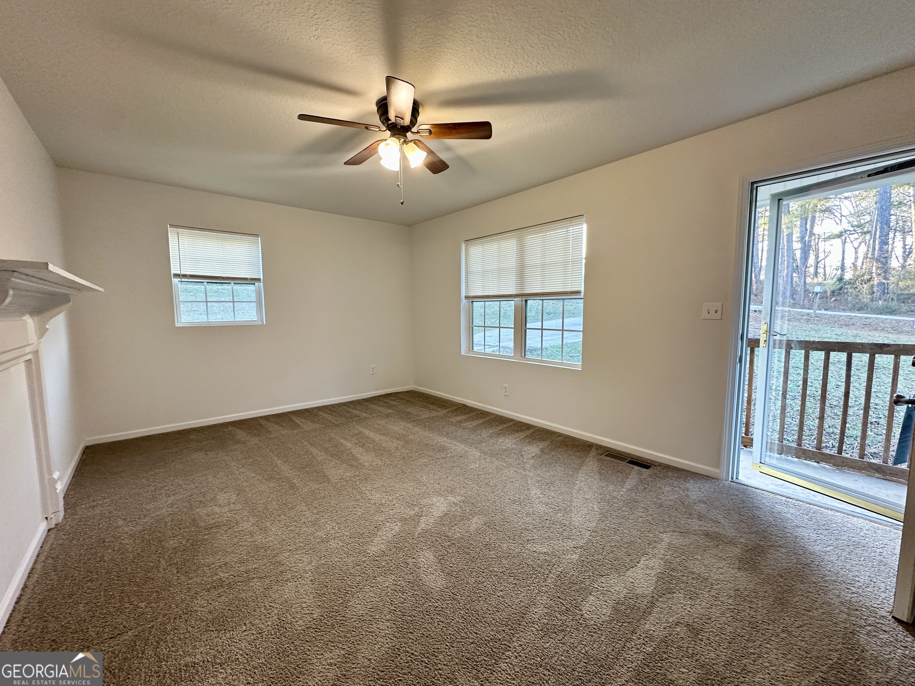 122 Forest Avenue Commerce, GA 30529 - Photo 3 of 17 a view of an empty room with a window