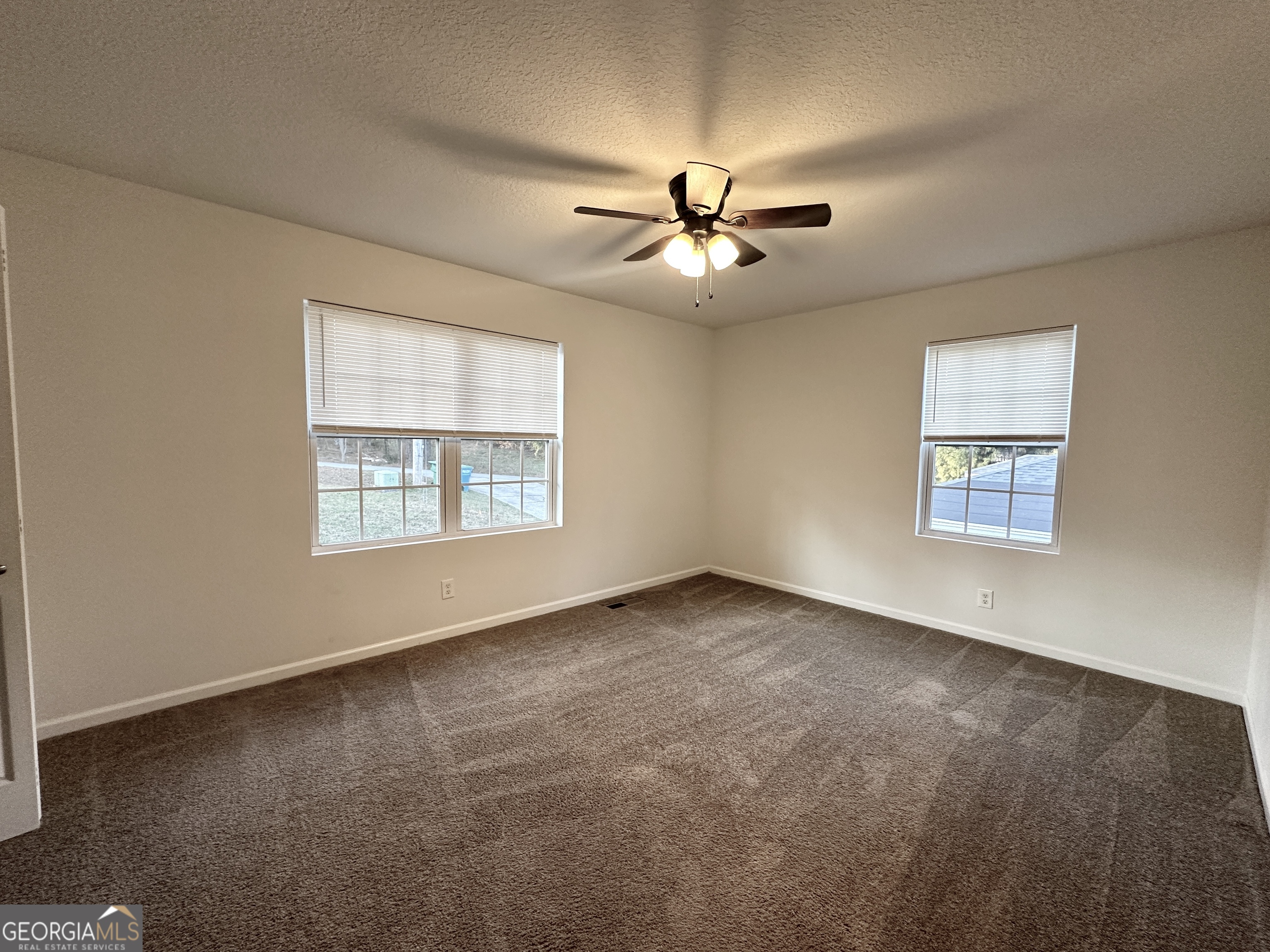 122 Forest Avenue Commerce, GA 30529 - Photo 10 of 17 a view of an empty room with a window