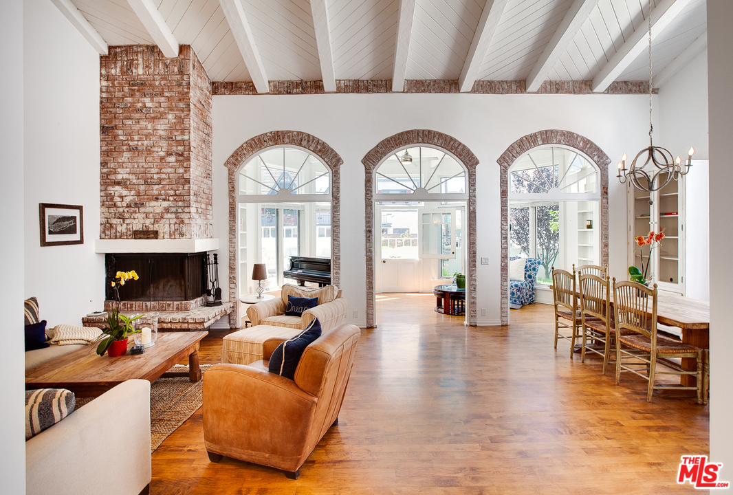 2327 Eastern Court Venice, CA 90291 - Photo 11 of 44 a living room with fireplace furniture and a large window