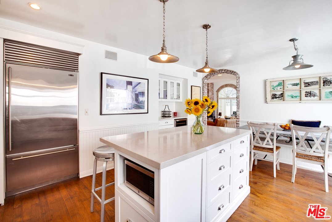 2327 Eastern Court Venice, CA 90291 - Photo 21 of 44 a kitchen with stainless steel appliances granite countertop a stove and a sink with dishwasher