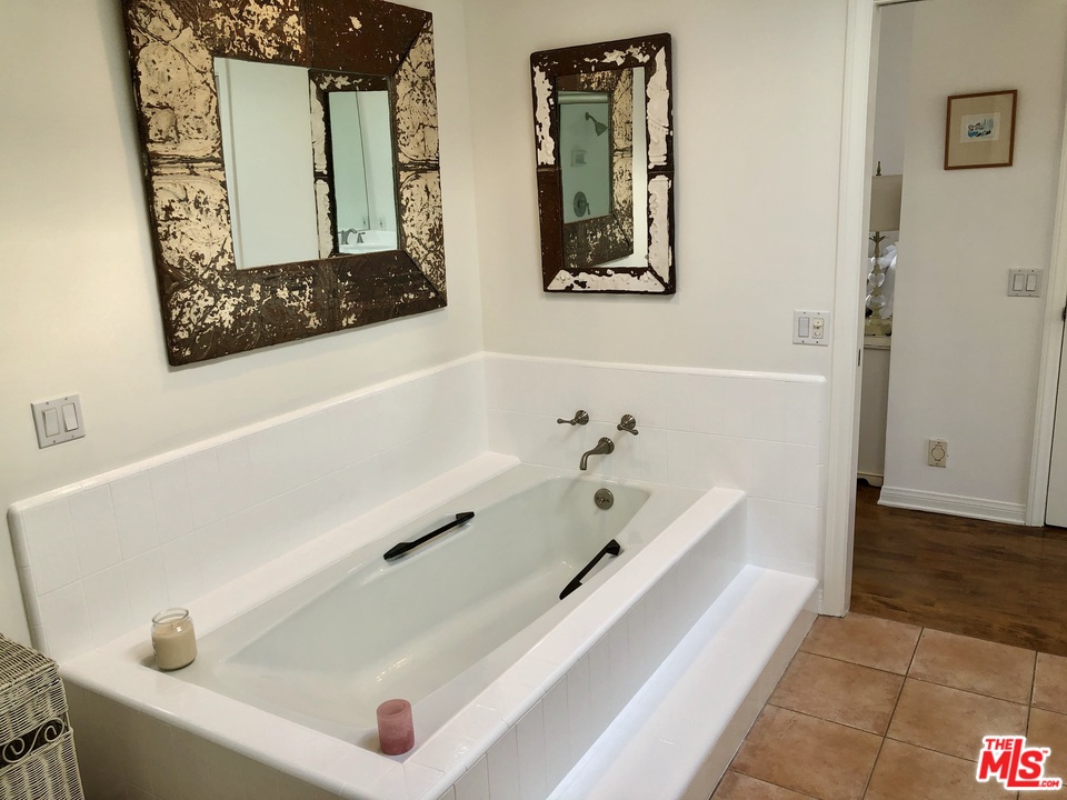 2327 Eastern Court Venice, CA 90291 - Photo 27 of 44 a bathroom with a tub and a shower