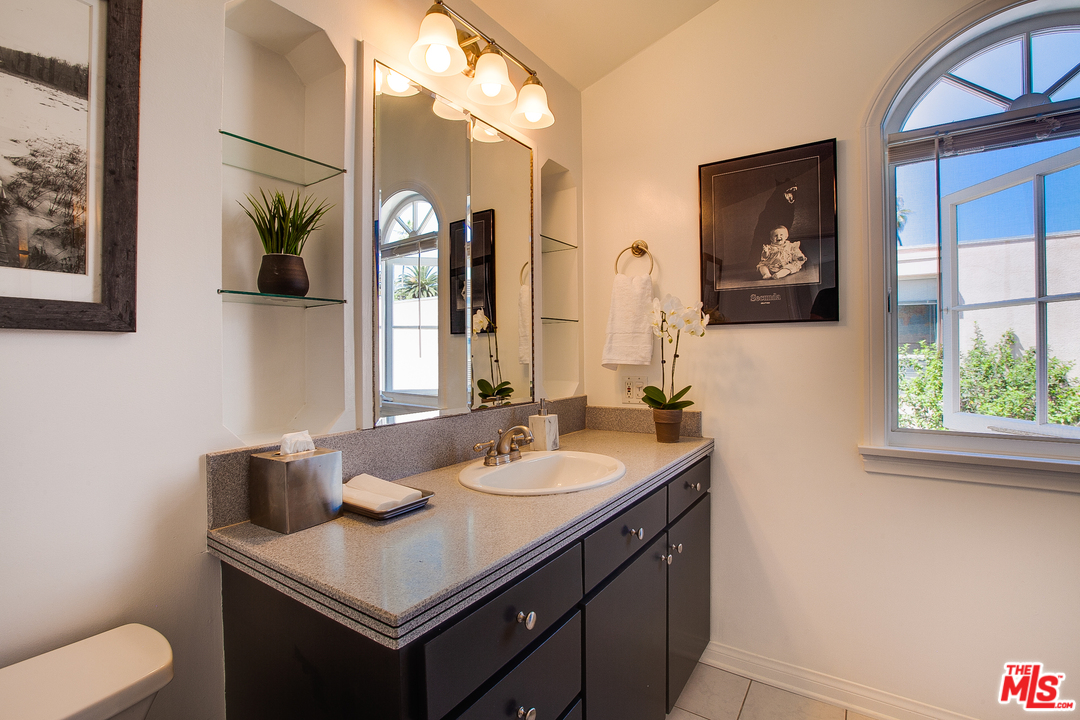 2327 Eastern Court Venice, CA 90291 - Photo 33 of 44 a bathroom with a toilet a sink and a mirror