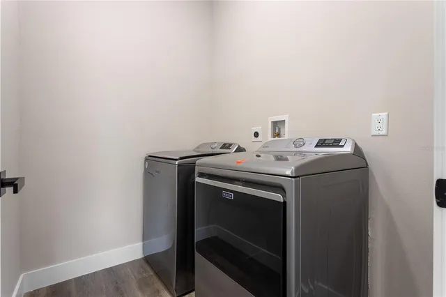 a utility room with dryer and washer