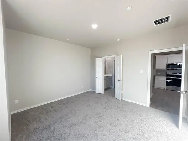 an empty room with furniture and closet