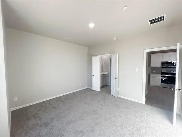 an empty room with furniture and closet